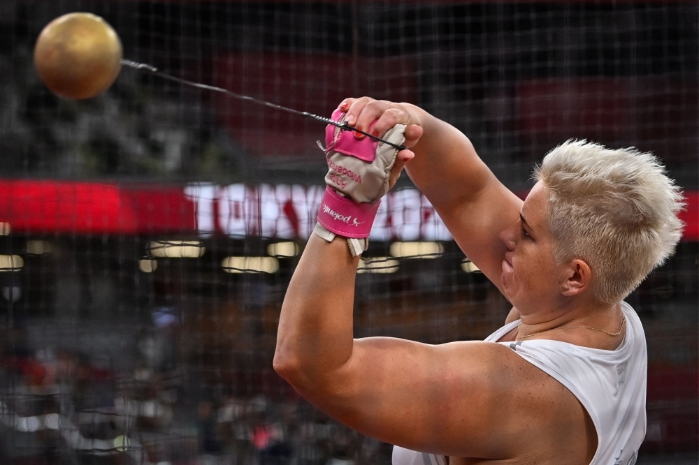 Poland's Anita Wlodarczyk competes in the women's hammer throw final during the Tokyo 2020 Olympic Games at the Olympic Stadium in Tokyo on August 3, 2021. (Photo by Andrej ISAKOVIC / AFP)